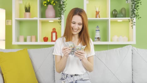 Happy-and-cheerful-woman-counting-money.